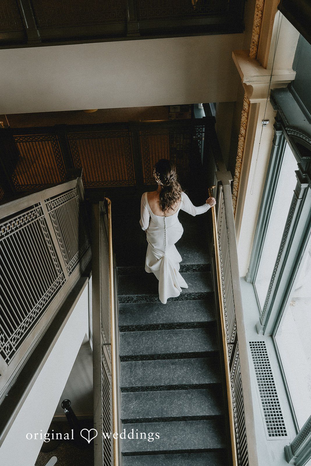 Spencer + Hilary The bride ascends the stairs gracefully