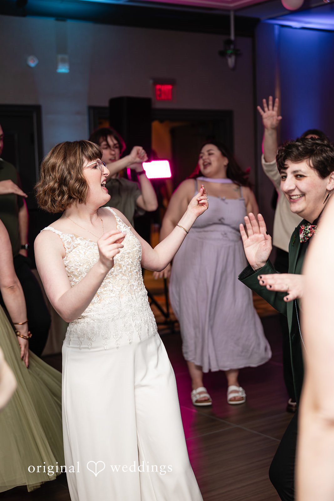 Sarah + Abby The couple and guests on the dance floor