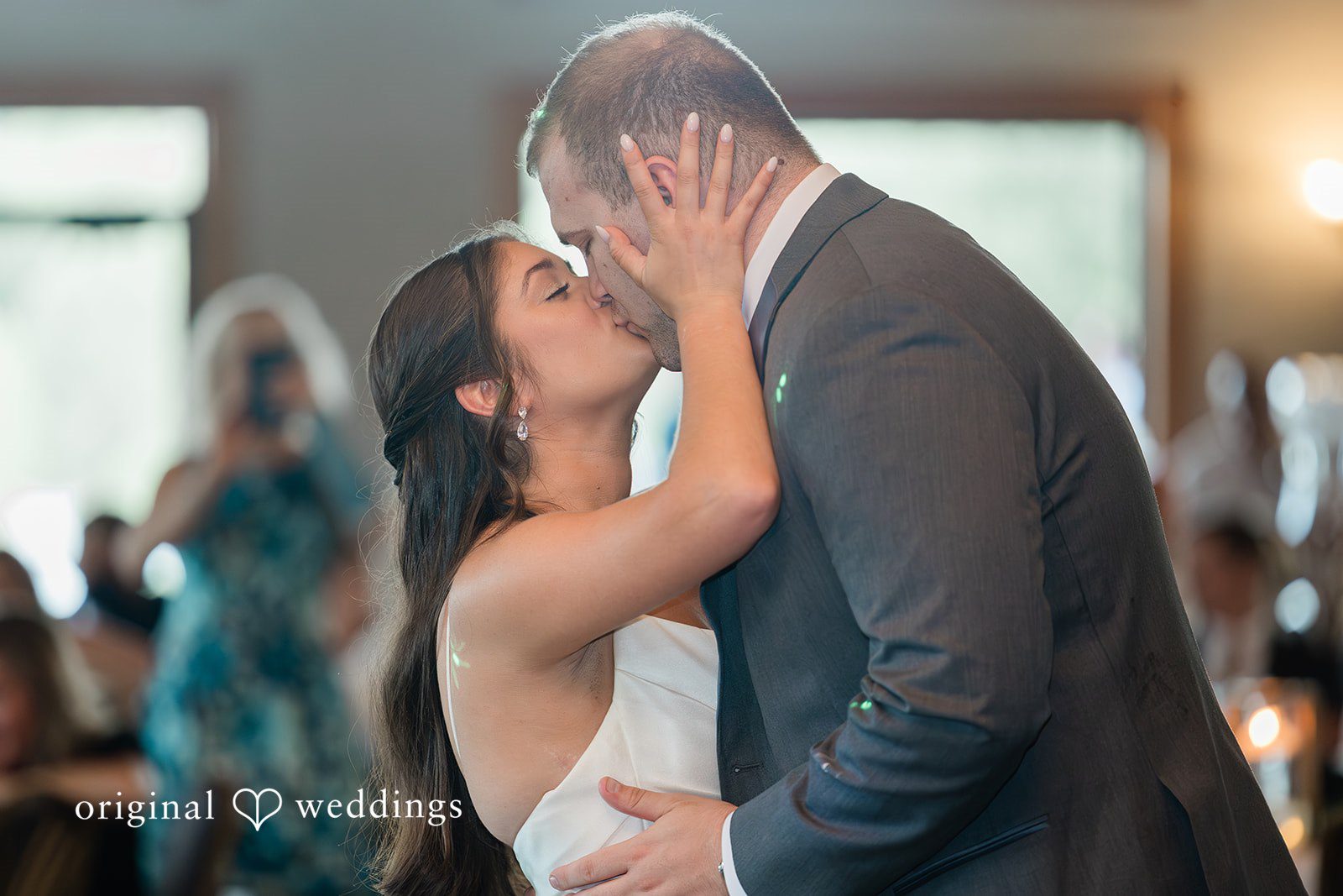 The couple shares a romantic kiss