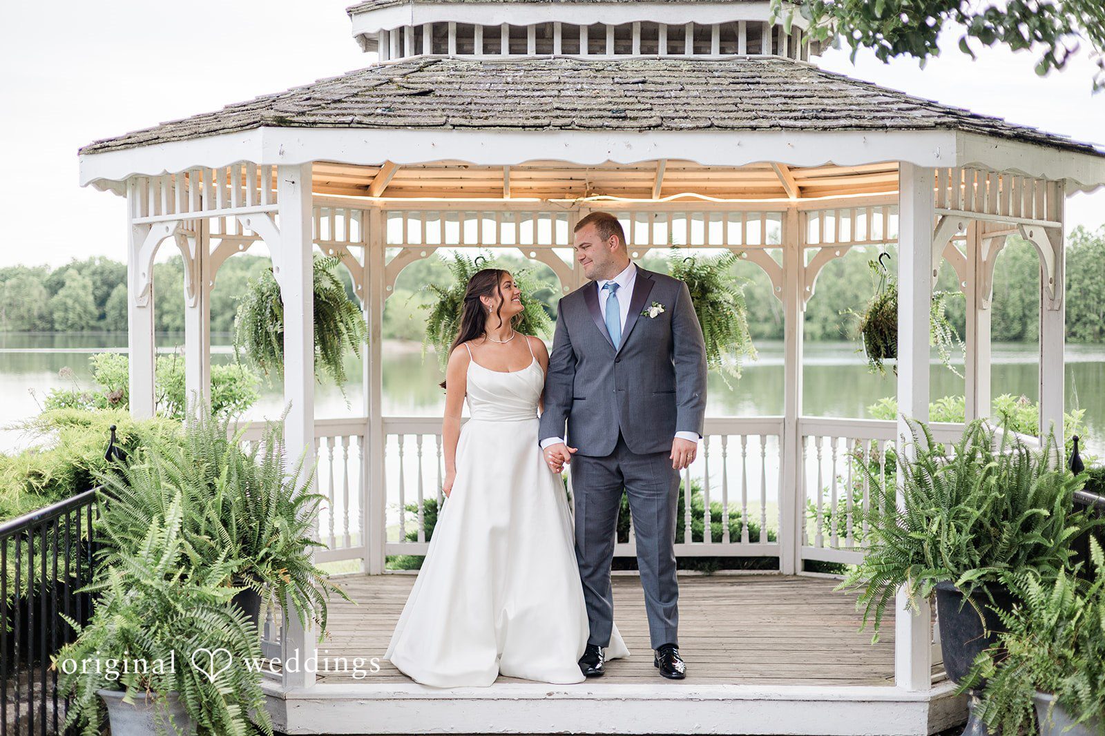 Our Cincinnati wedding photographers at Original Weddings captured a beautiful portrait of the couple by the gazebo at the Lake Lyndsay Event Center