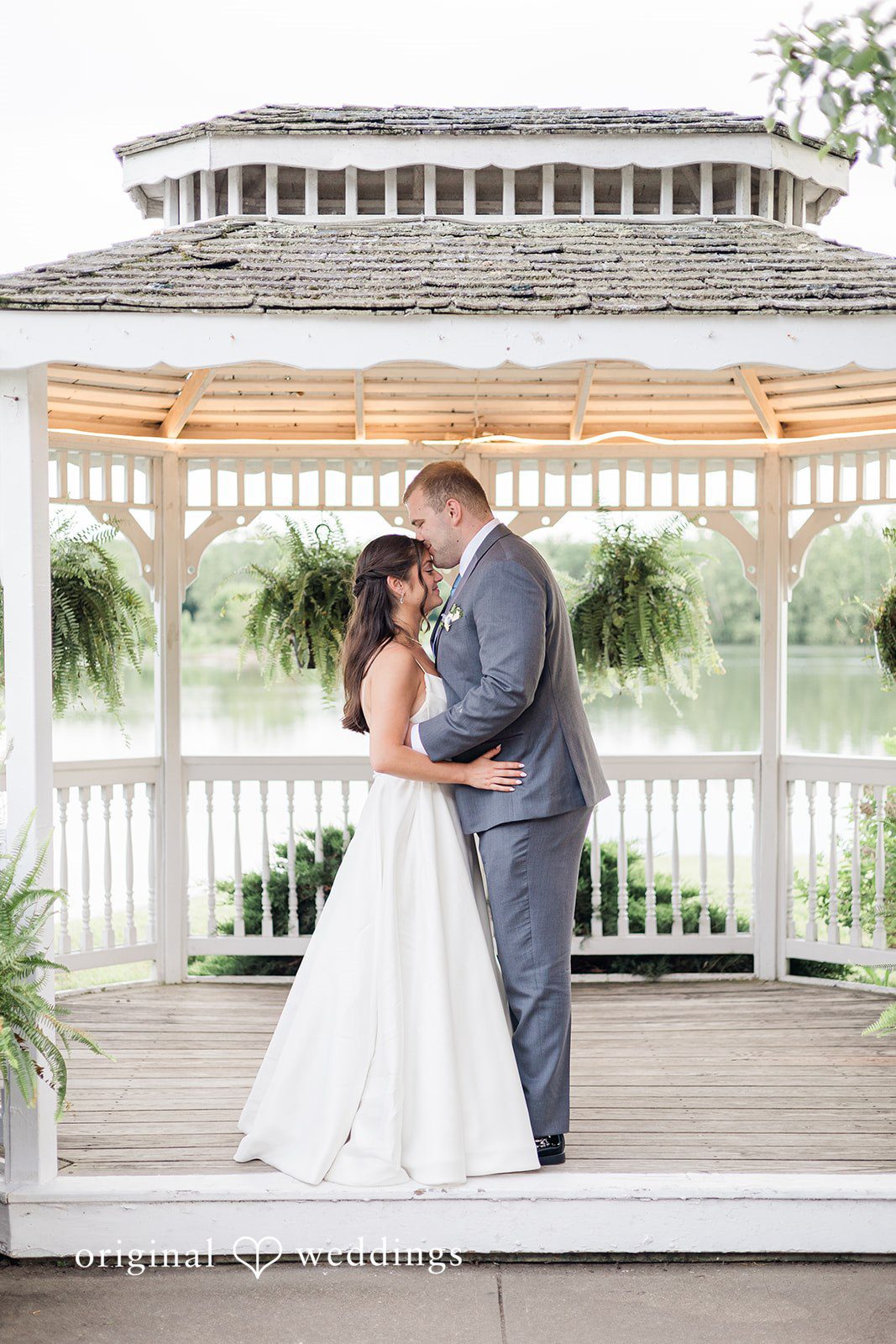 The couple shares a romantic moment by the gazebo