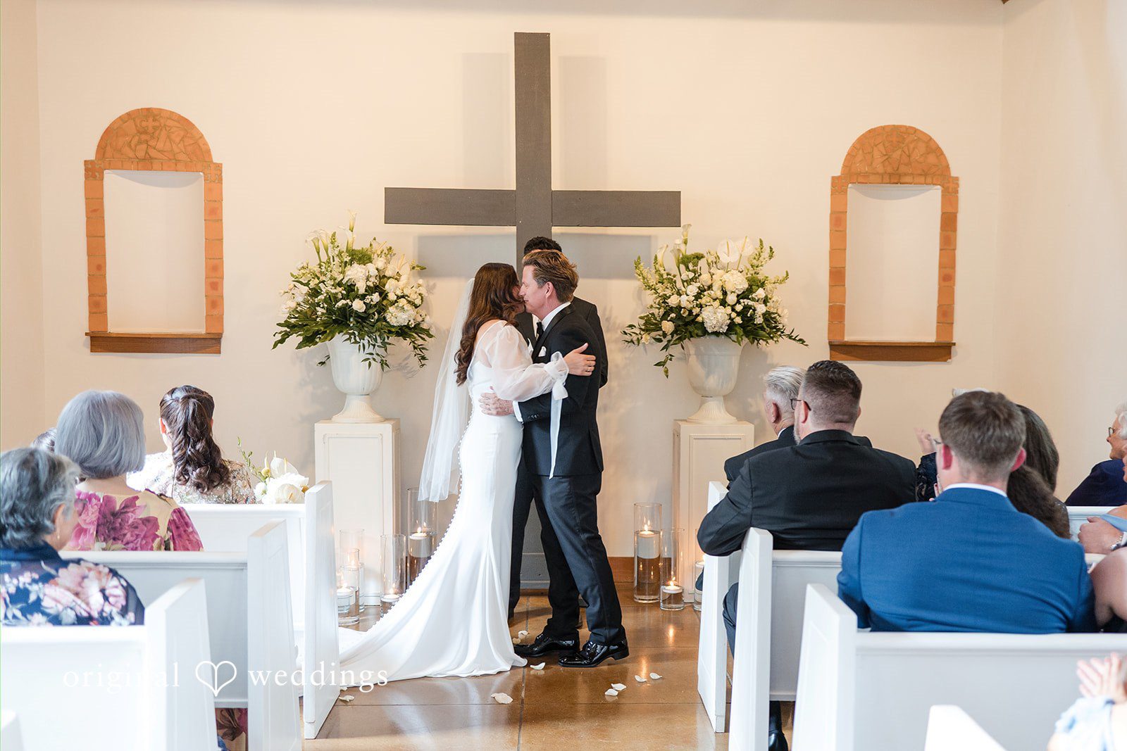 Bride and groom embracing after their vows