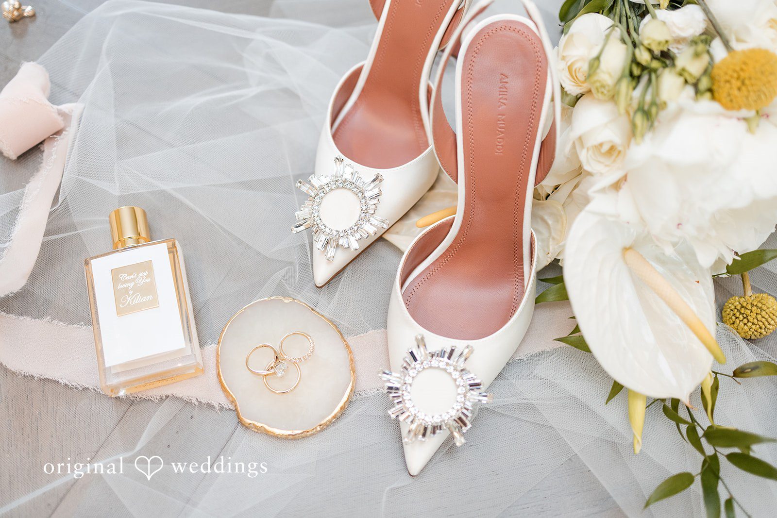 Engagement rings and bridal shoes detail photo