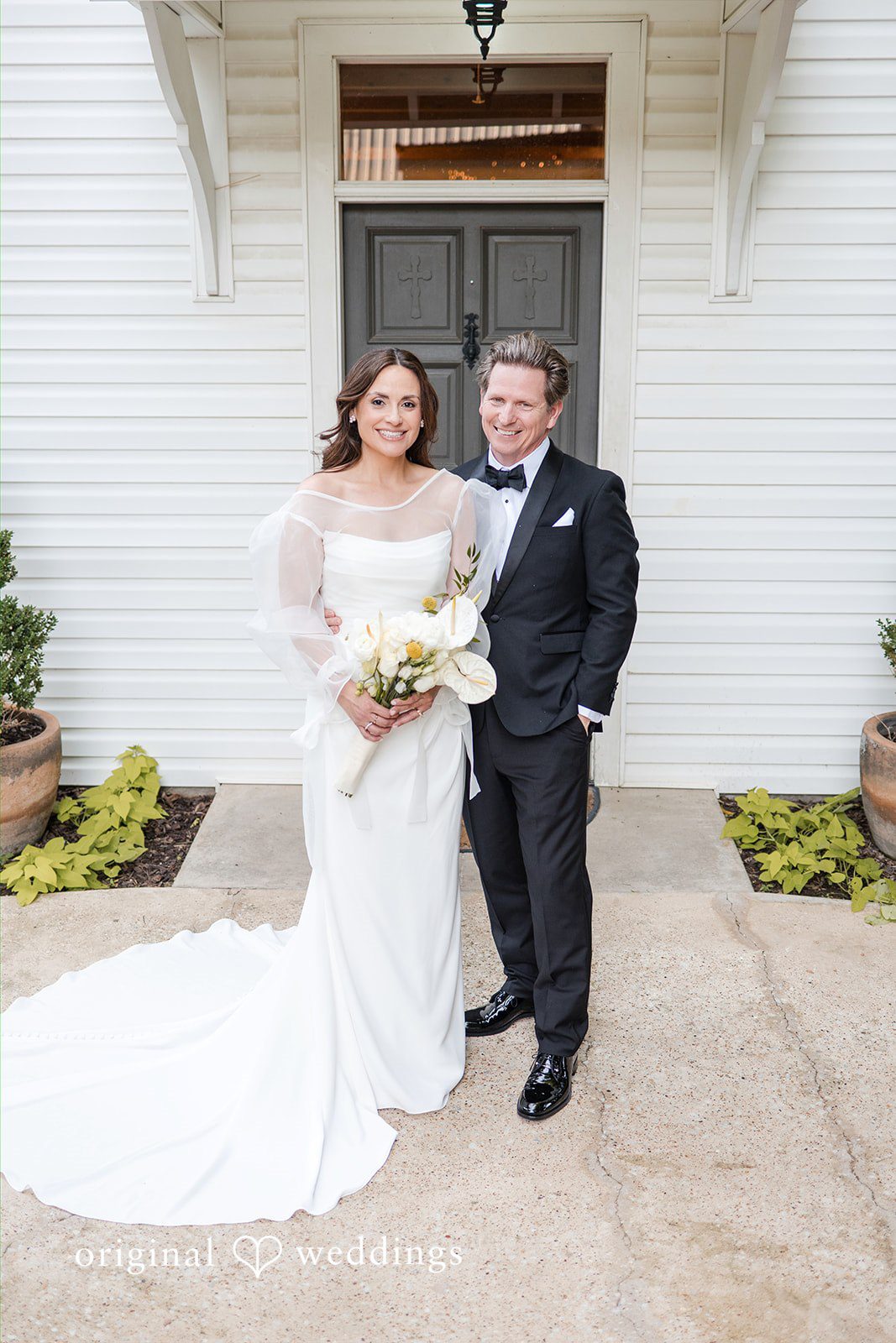 Bride and groom portrait in front of the venue
