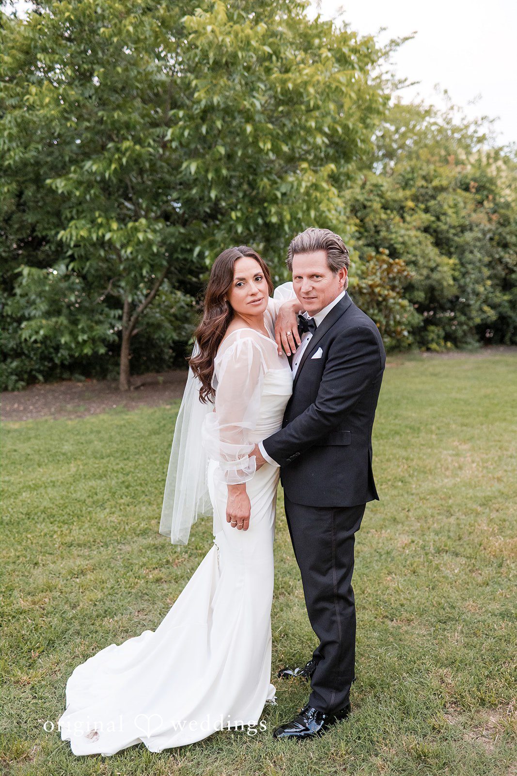 Full-length portrait of the couple on the grass