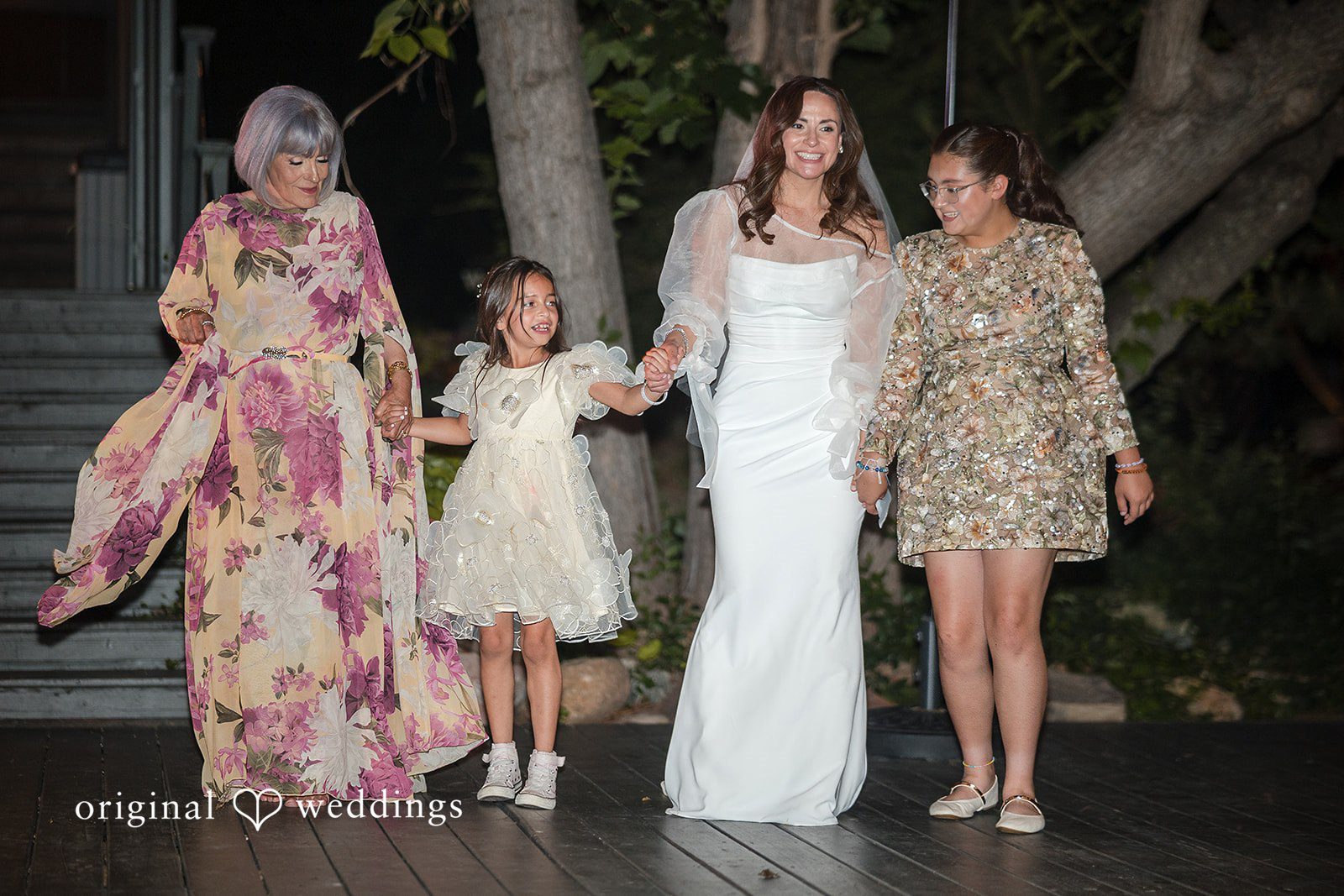 Bride posing with her family during the wedding day