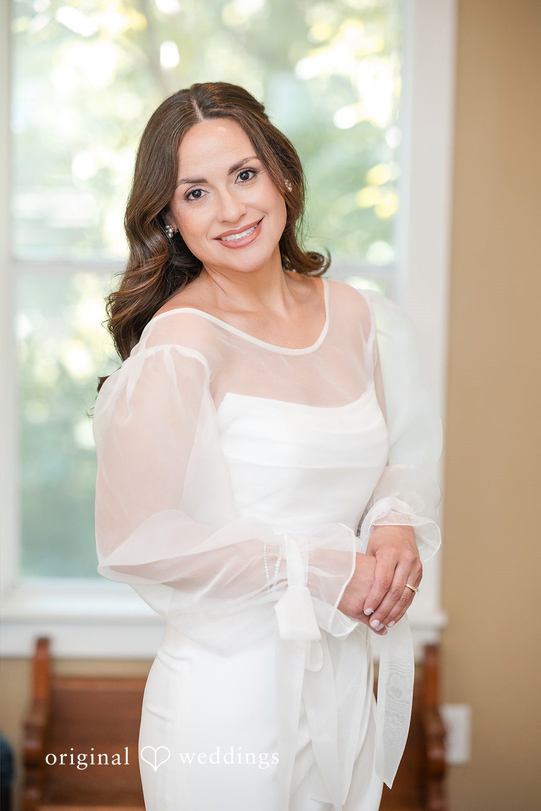 Bride smiling after completing her wedding preparations