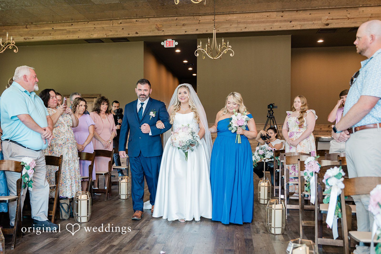 Bride walking down the aisle at Luna's Trail Venue.