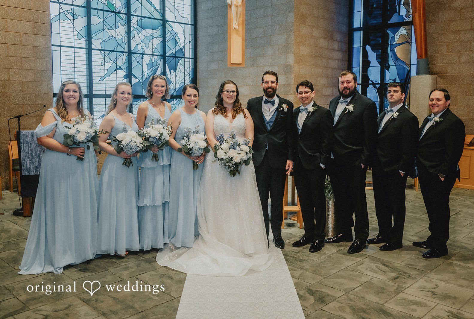A full wedding party posing together for a group photo captured by Chicago Wedding Photographers from Original Weddings.