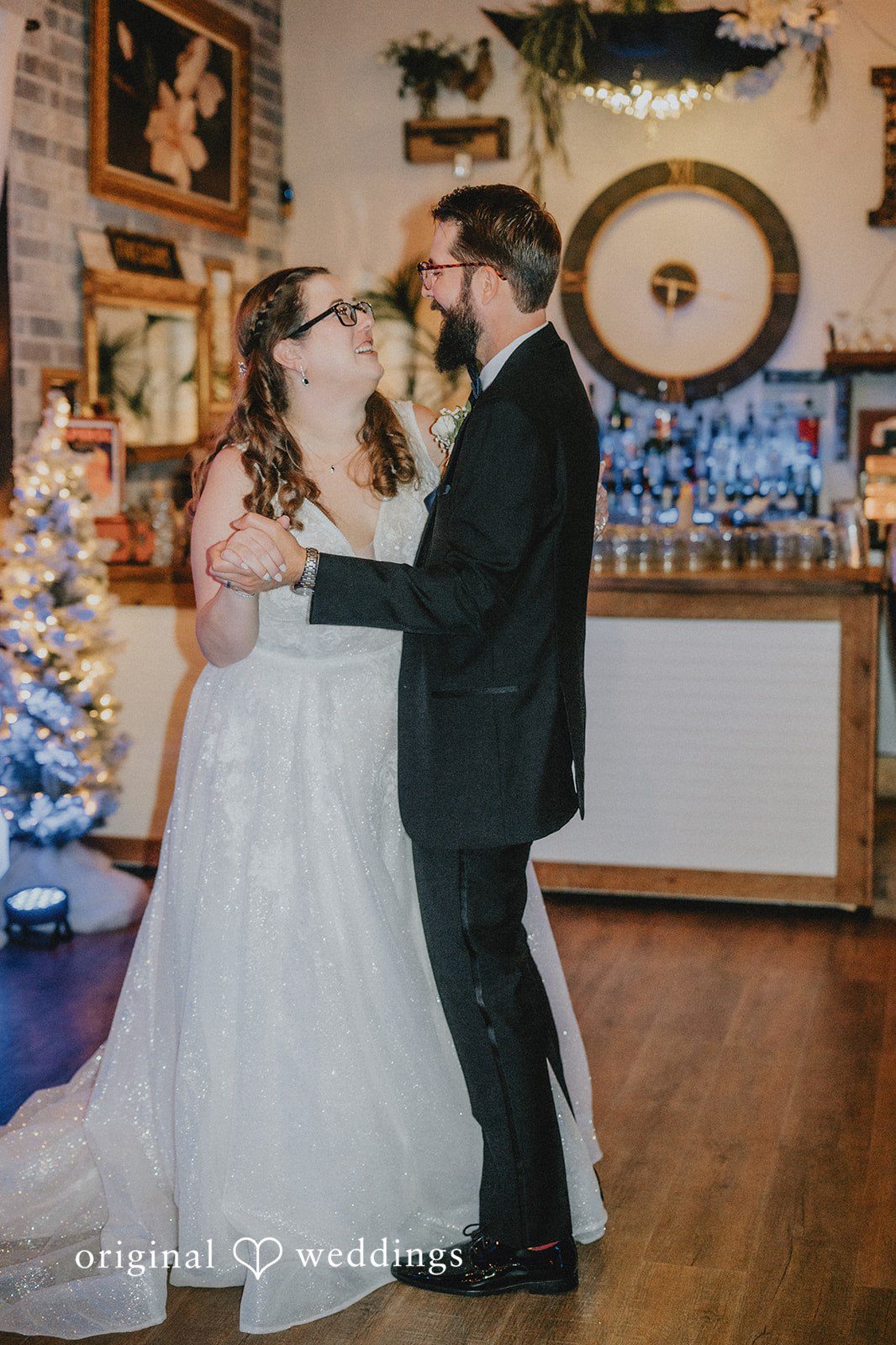 Daniel + Amanda A bride and groom sharing their dance on a wooden floor.