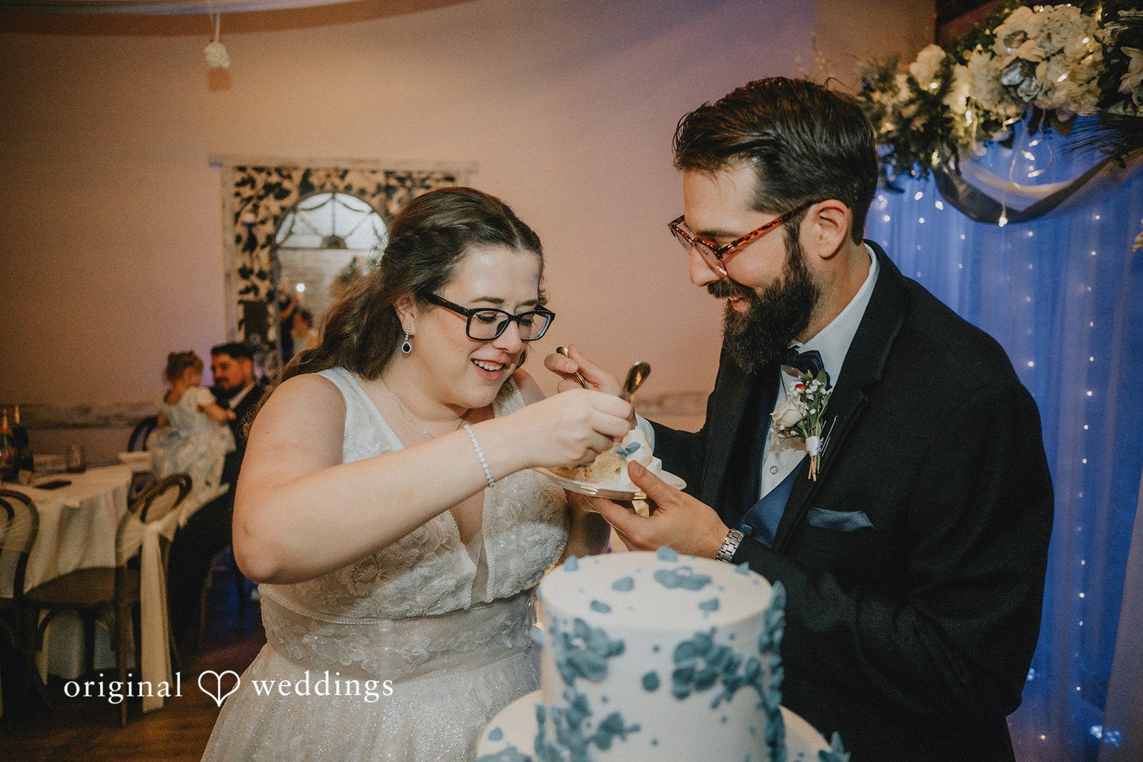 Daniel + Amanda A bride and groom cutting their wedding cake together.