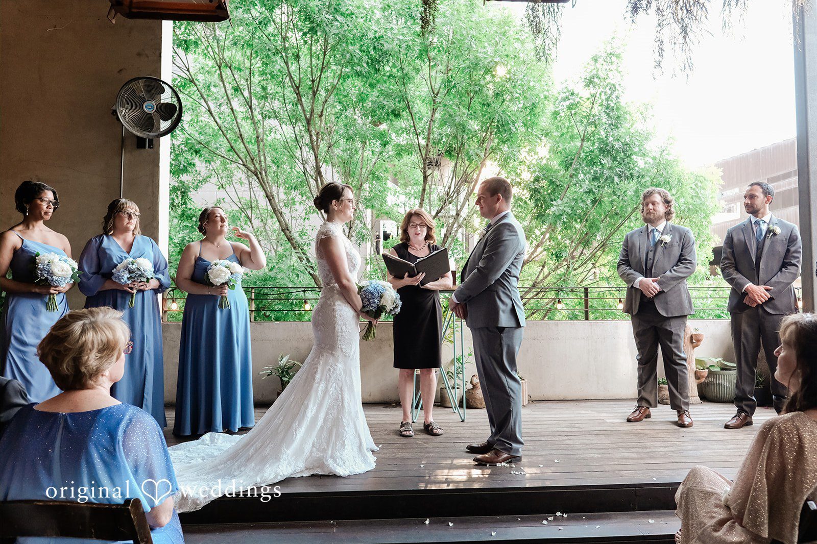 Couple celebrating their wedding at Malverde at La Condesa in Austin with dusty blue and sage details during an intimate ceremony and reception