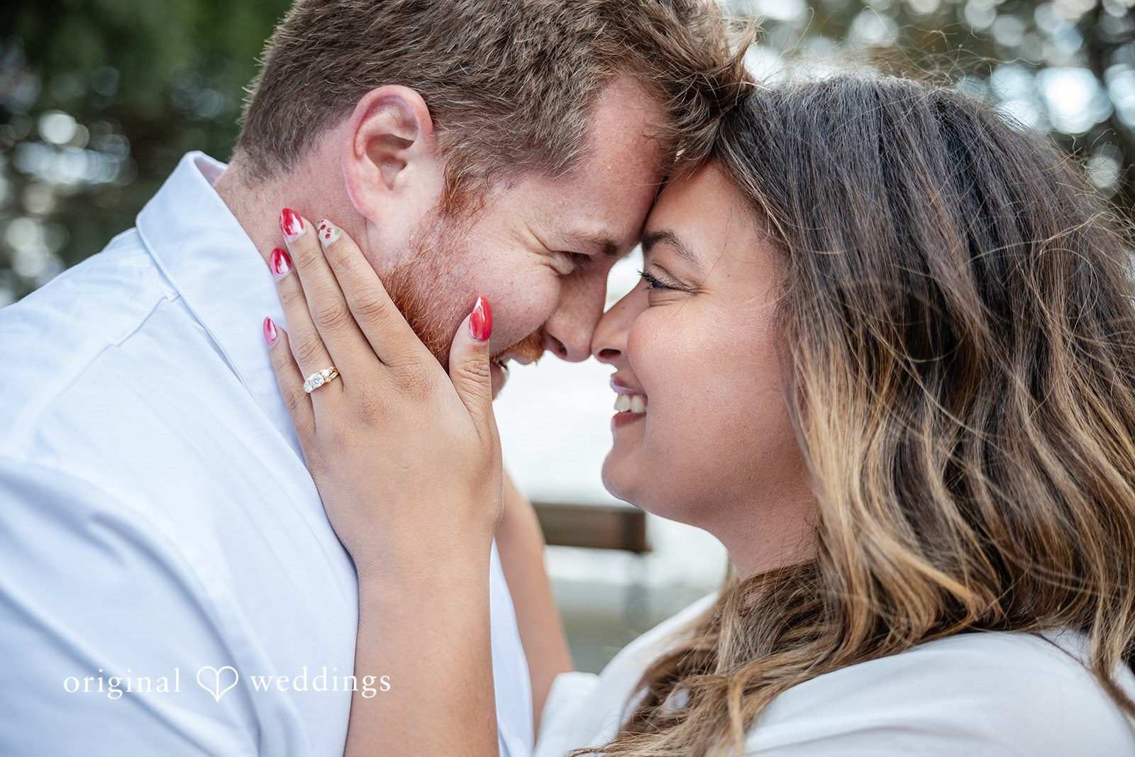 A romantic headshot portrait of the couple