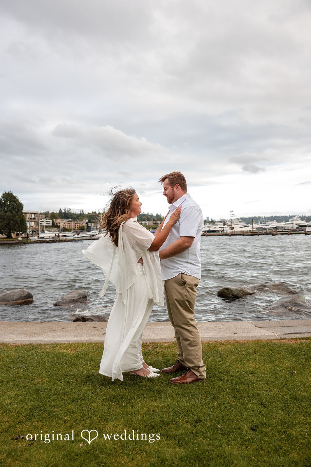 The couple shares a romantic moment at the waterfront