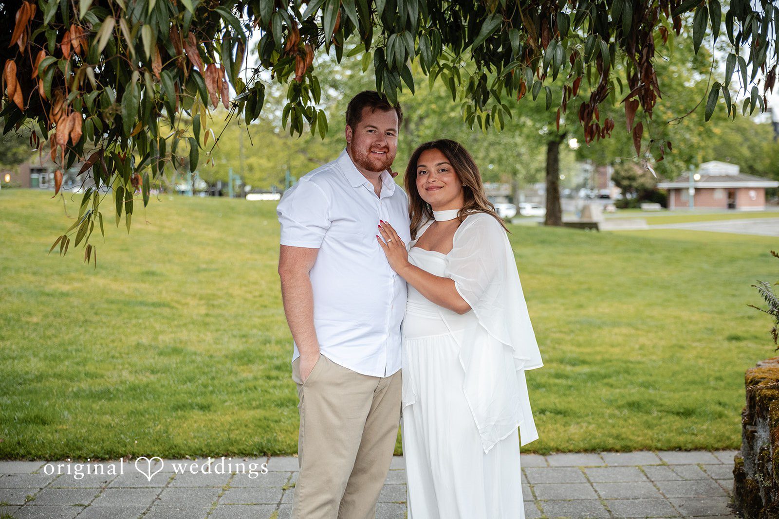 A stunning portrait of the couple at the manicured lawn