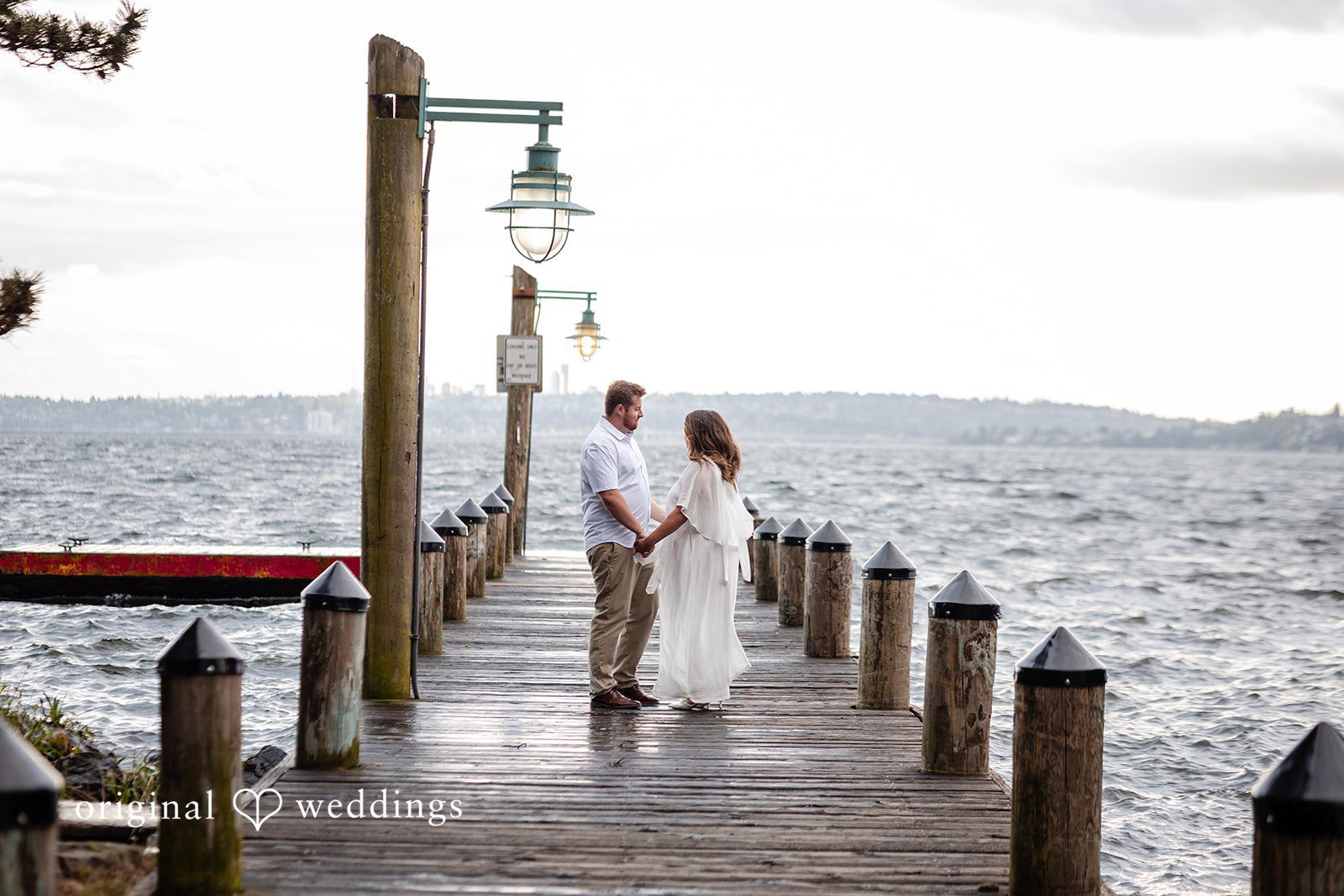 The couple shares a romantic moment framed by nature