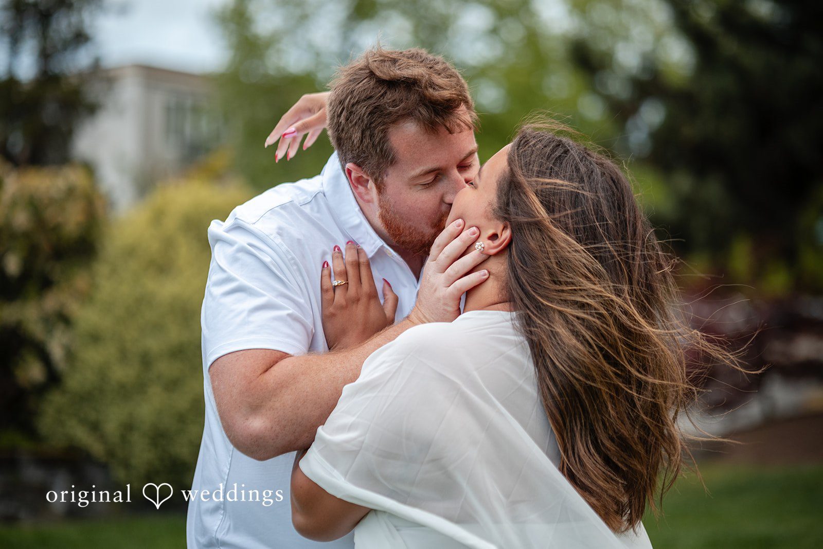 The couple kisses
