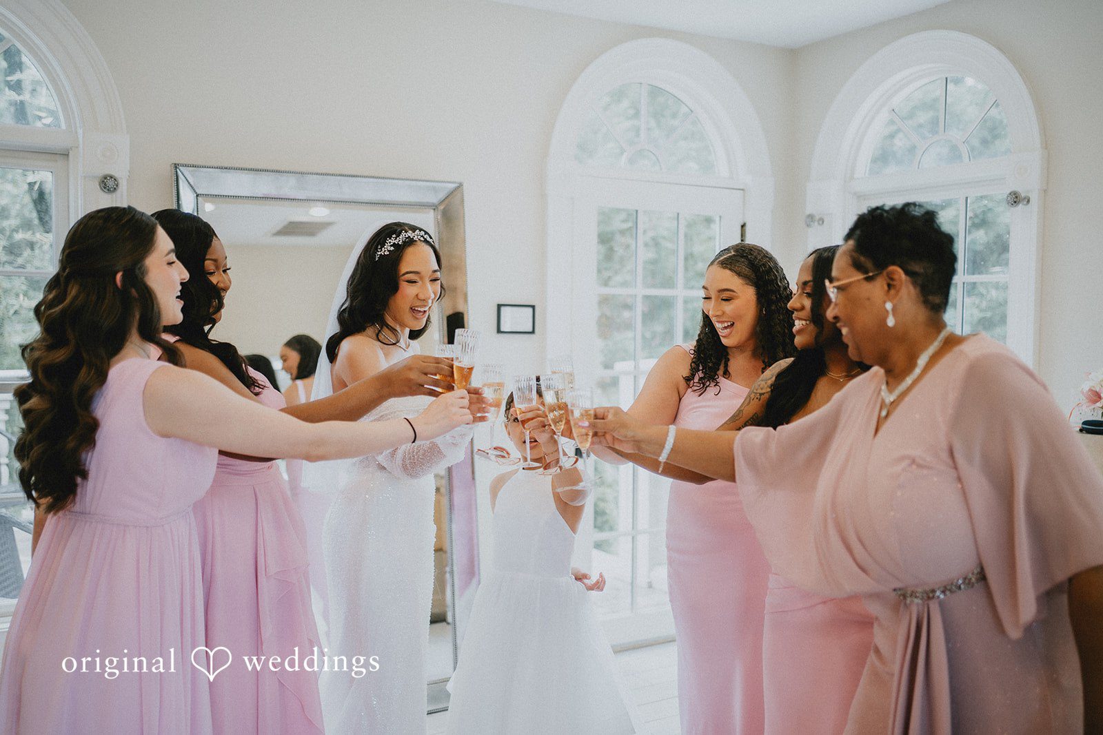 Destiny + Daniel The bride shares a toast with her bridal party