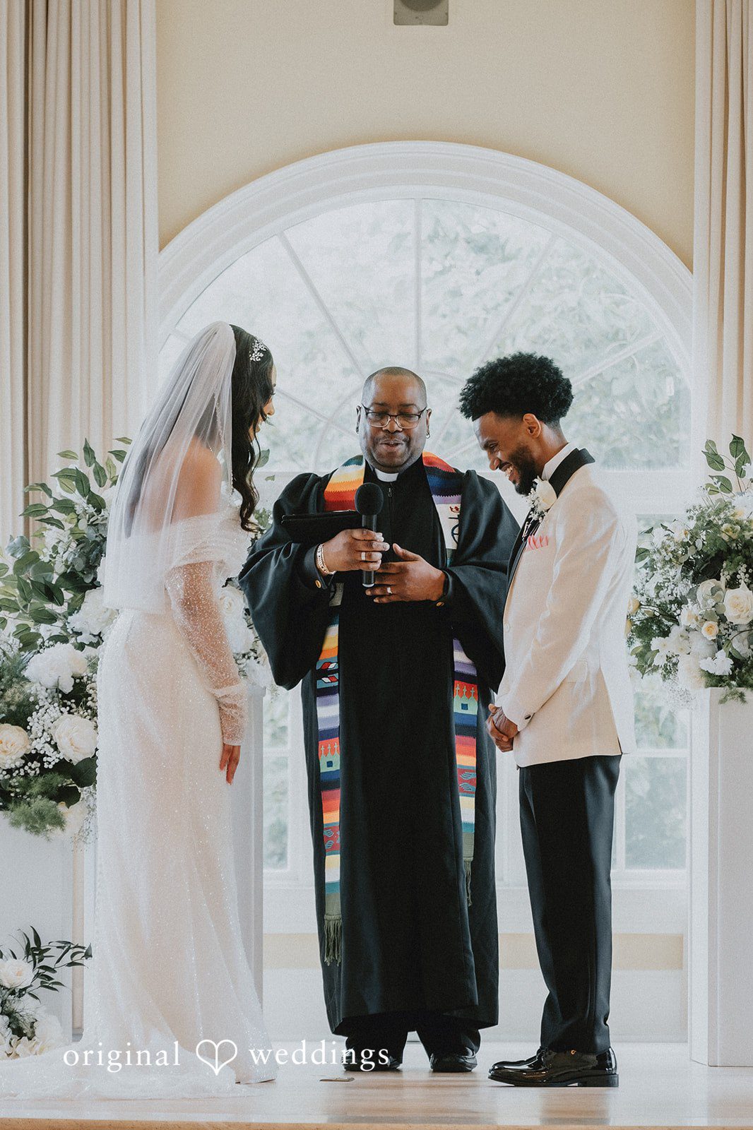 Destiny + Daniel The priest prays for the couple