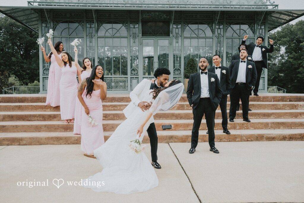 Destiny + Daniel Our DC wedding photographers at Original Weddings captured a romantic portrait of the couple with cheers from their bridal party at Morais Vineyard & Winery