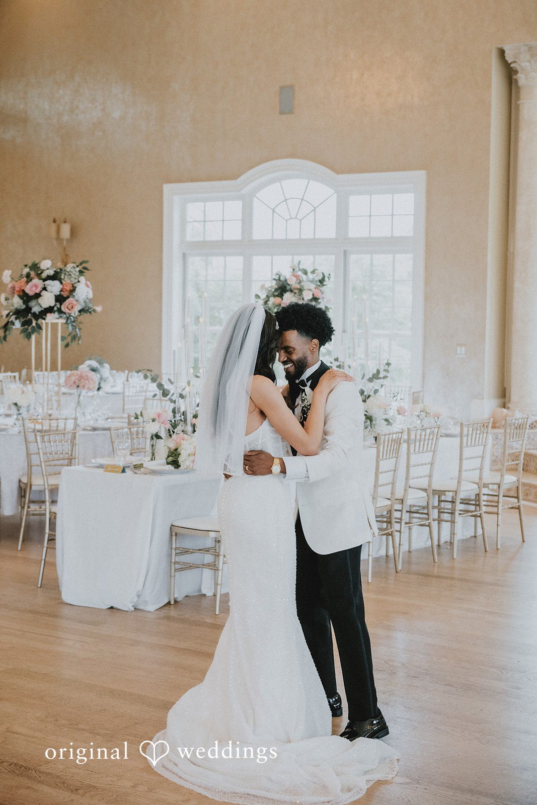 Destiny + Daniel The couple shares a hug at their wedding reception