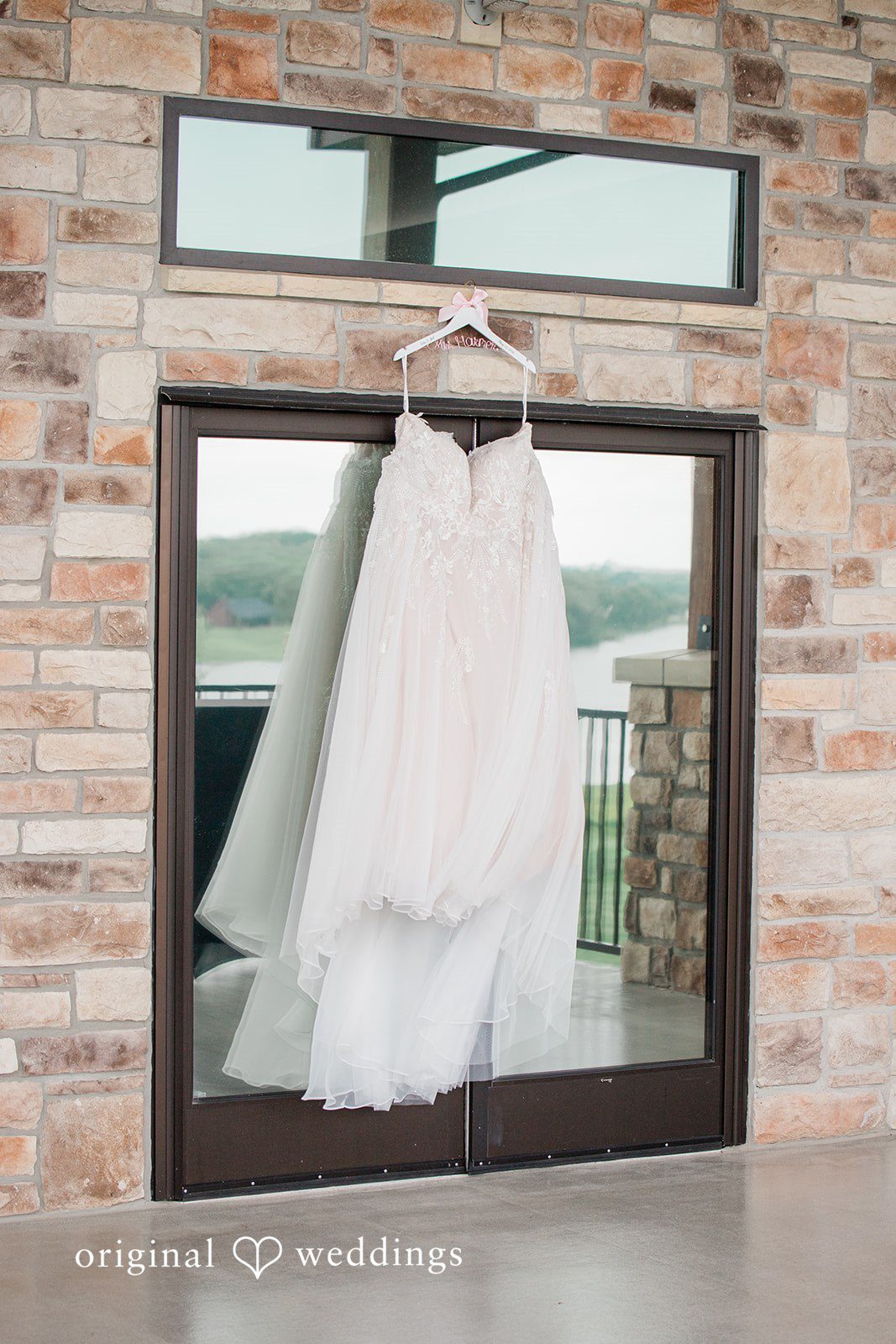 The bride's wedding gown gracefully hanging