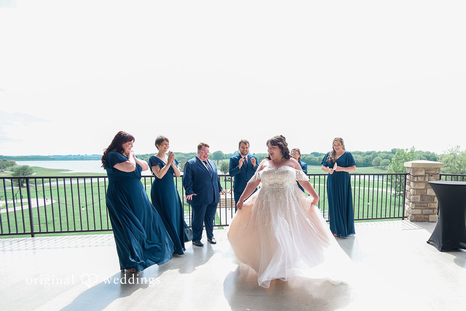 The bridesmaids are in awe of the bride