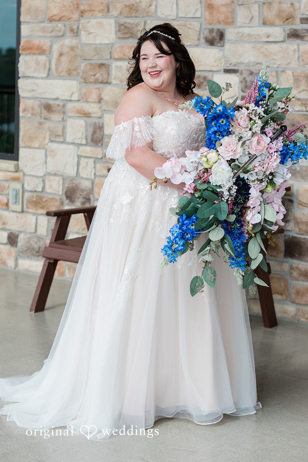 A stunning portrait of the bride holding her bouquet