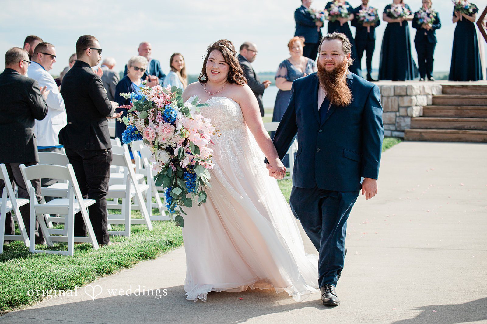 Our Kansas City wedding photographers captured the moment the couple made a joyful exit after their wedding ceremony