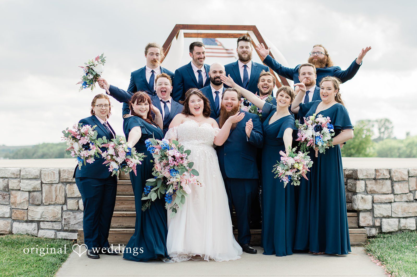 Our Kansas City wedding photographers at Original Weddings captured a fun portrait of the couple and their bridal party at Mozingo