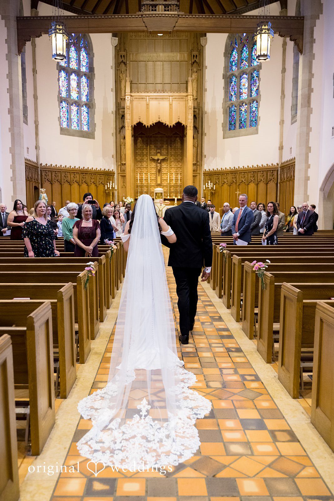 Kiarra + Anthony Romantic bride entrance back pose at Nativity of Our Lord Catholic Church