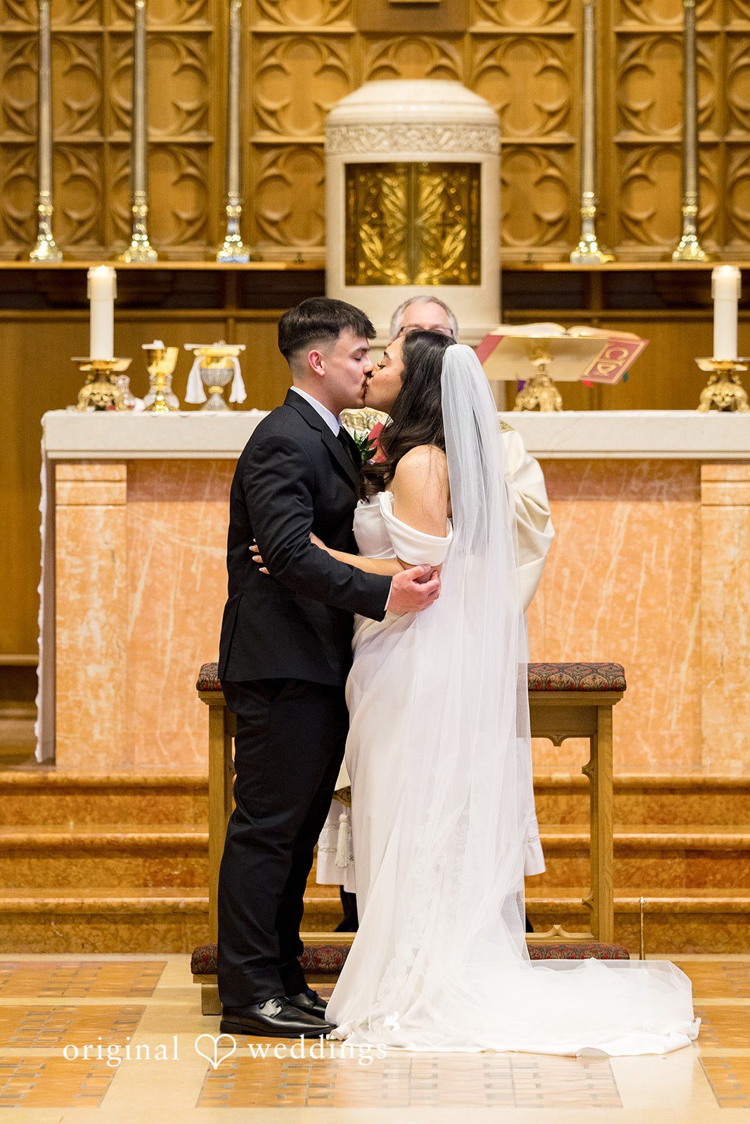 Kiarra + Anthony Romantic wedding kiss couple photography at Nativity of Our Lord Catholic Church