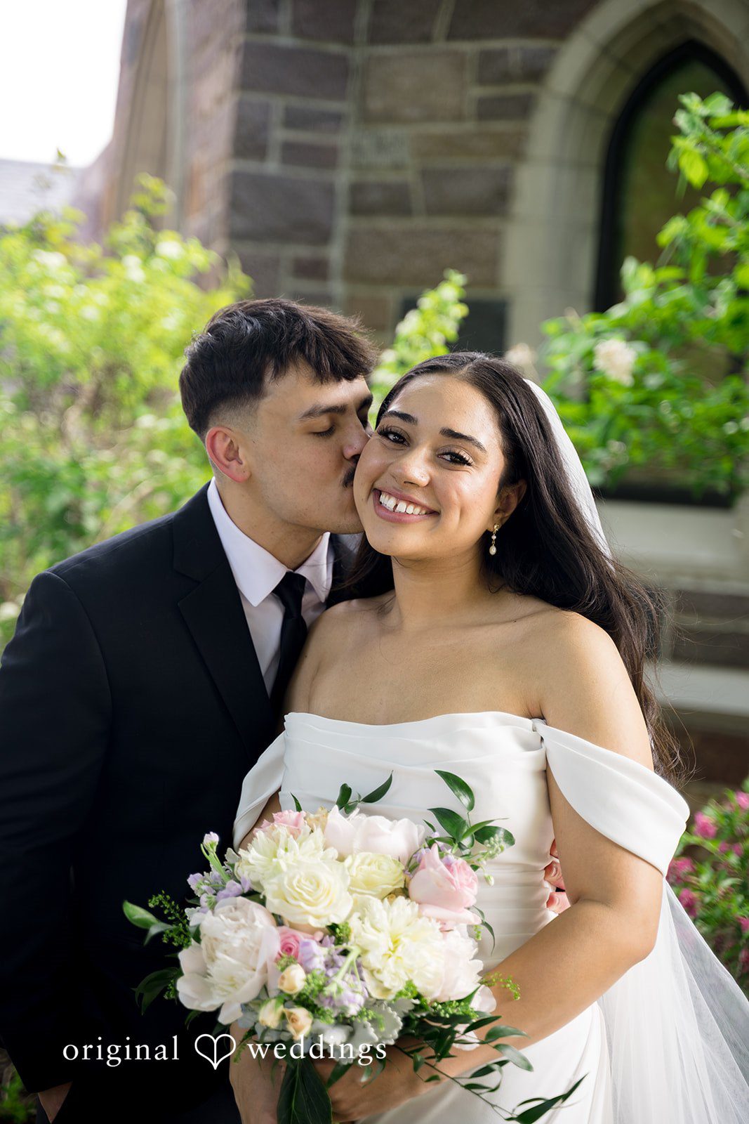 Kiarra + Anthony Beautiful emotional couple cheek kiss photography at Nativity of Our Lord Catholic Church