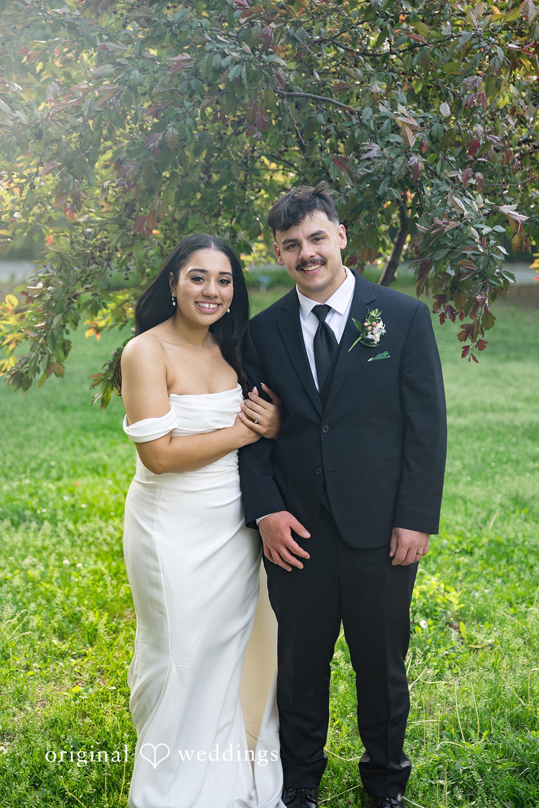 Kiarra + Anthony Romantic couple smiling photoshoot at Nativity of Our Lord Catholic Church