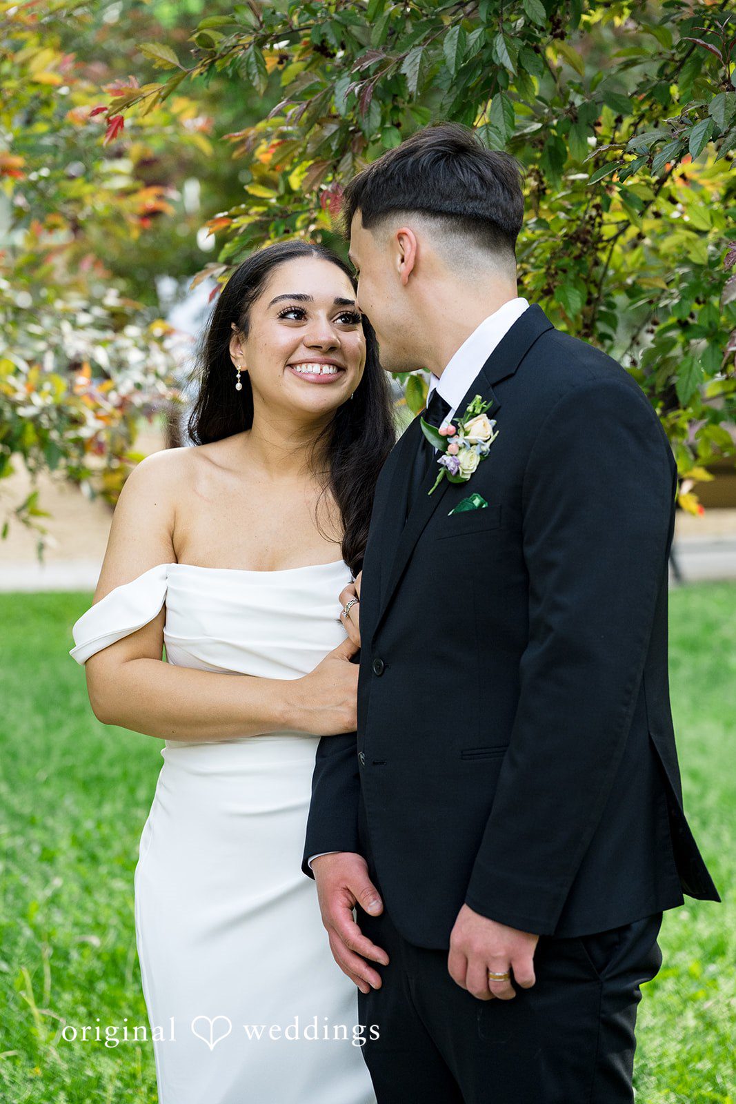 Kiarra + Anthony Romantic couple smiling wedding moment while looking at each other at Nativity of Our Lord Catholic Church