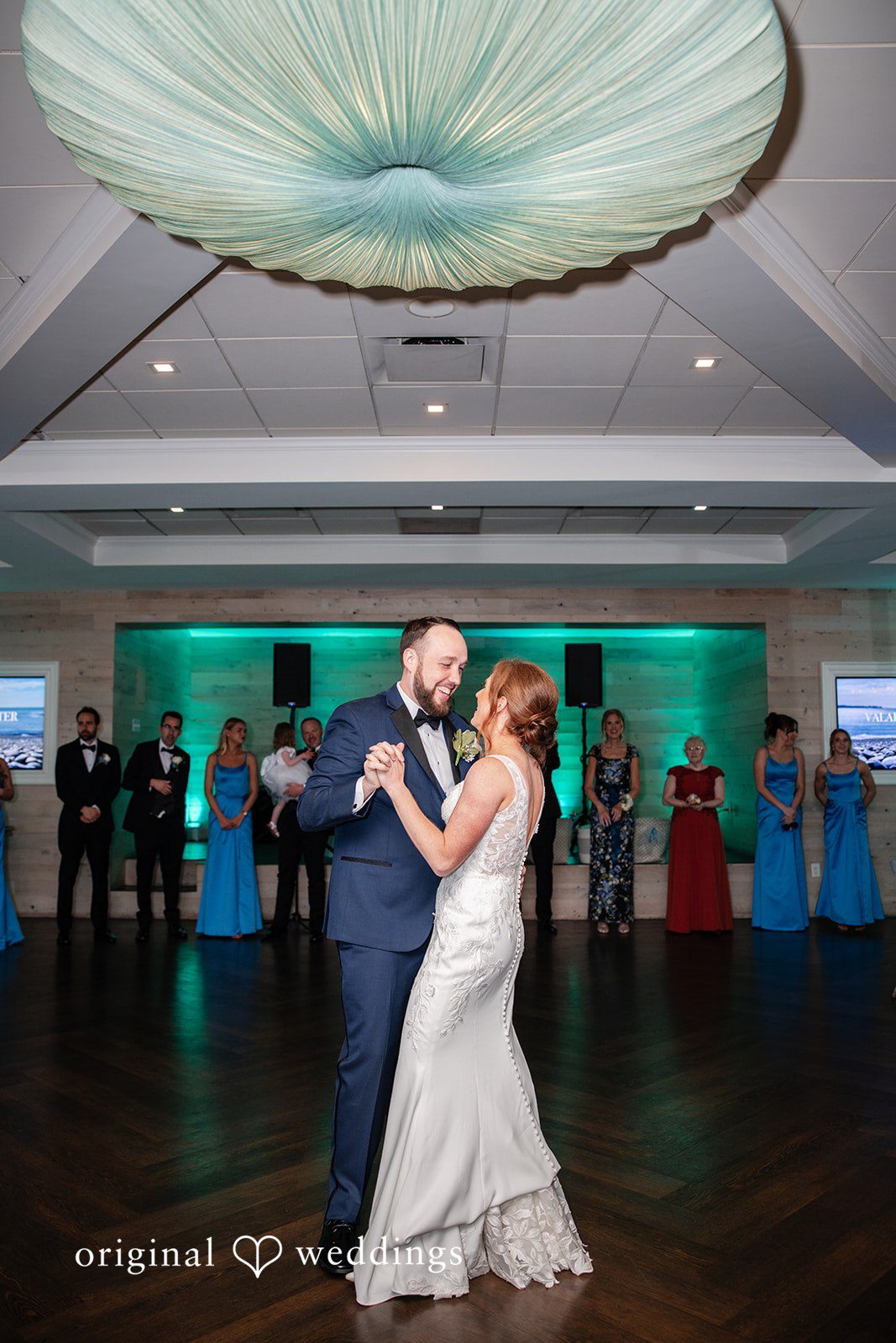 First dance of the newlyweds captured from a distance at the reception