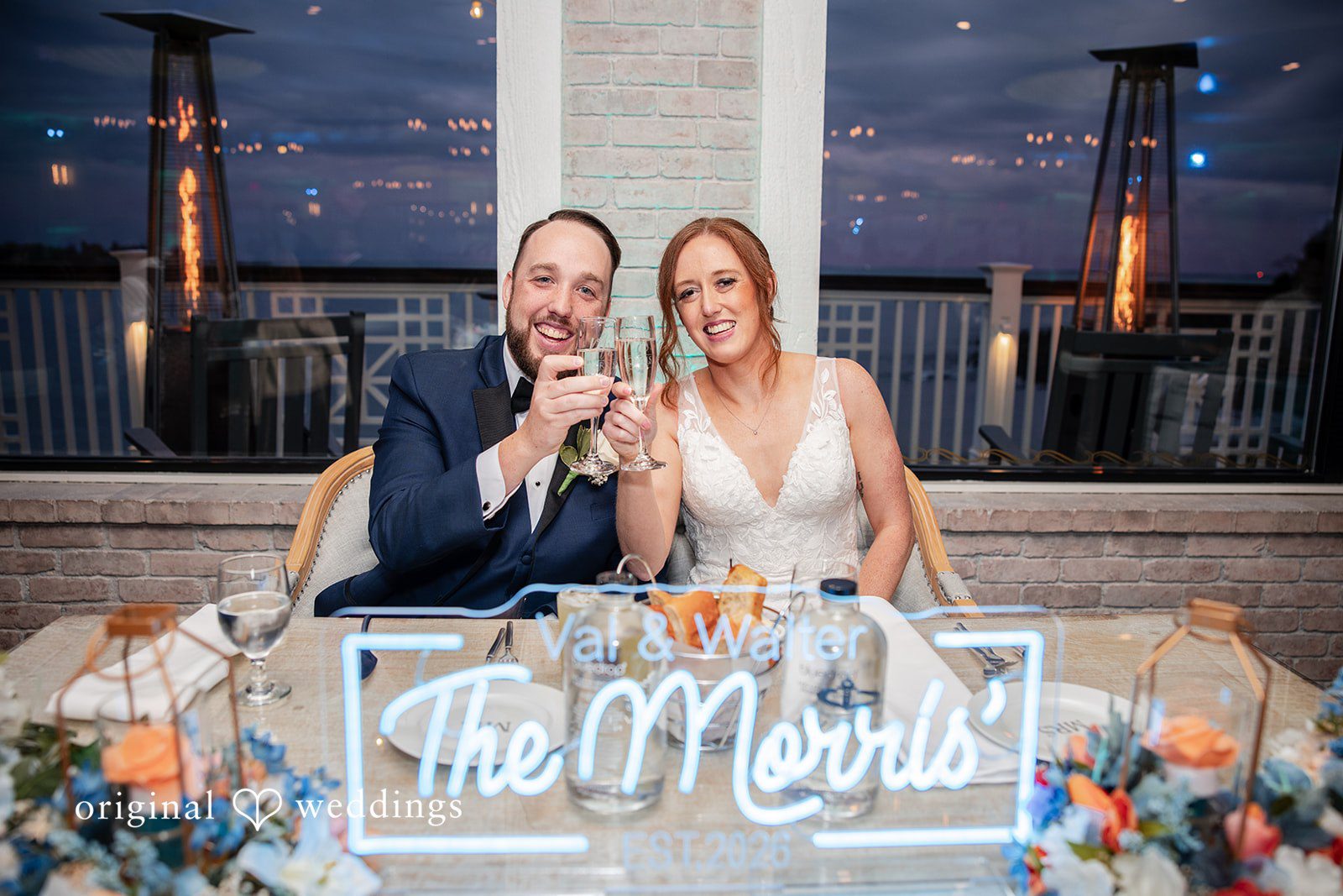 Newlyweds enjoying drinks together during the wedding reception