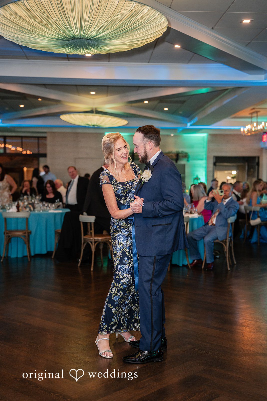 Groom dancing with his mother during a heartfelt reception moment