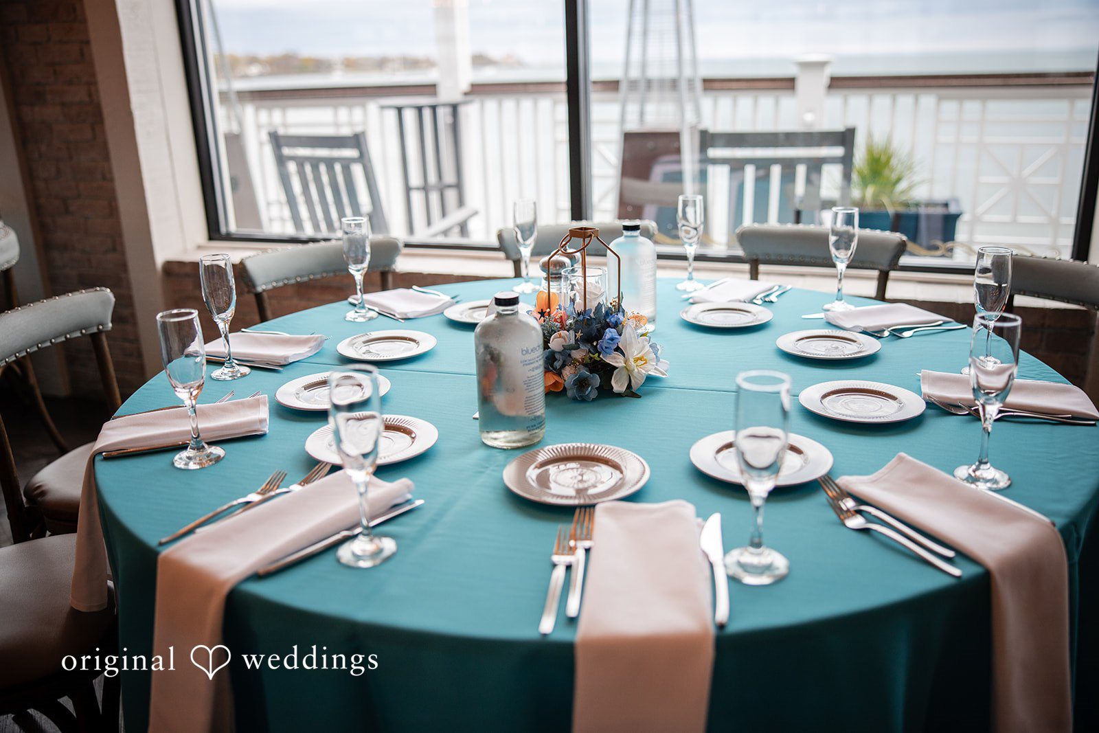 Close-up of beautifully styled reception table décor and place settings