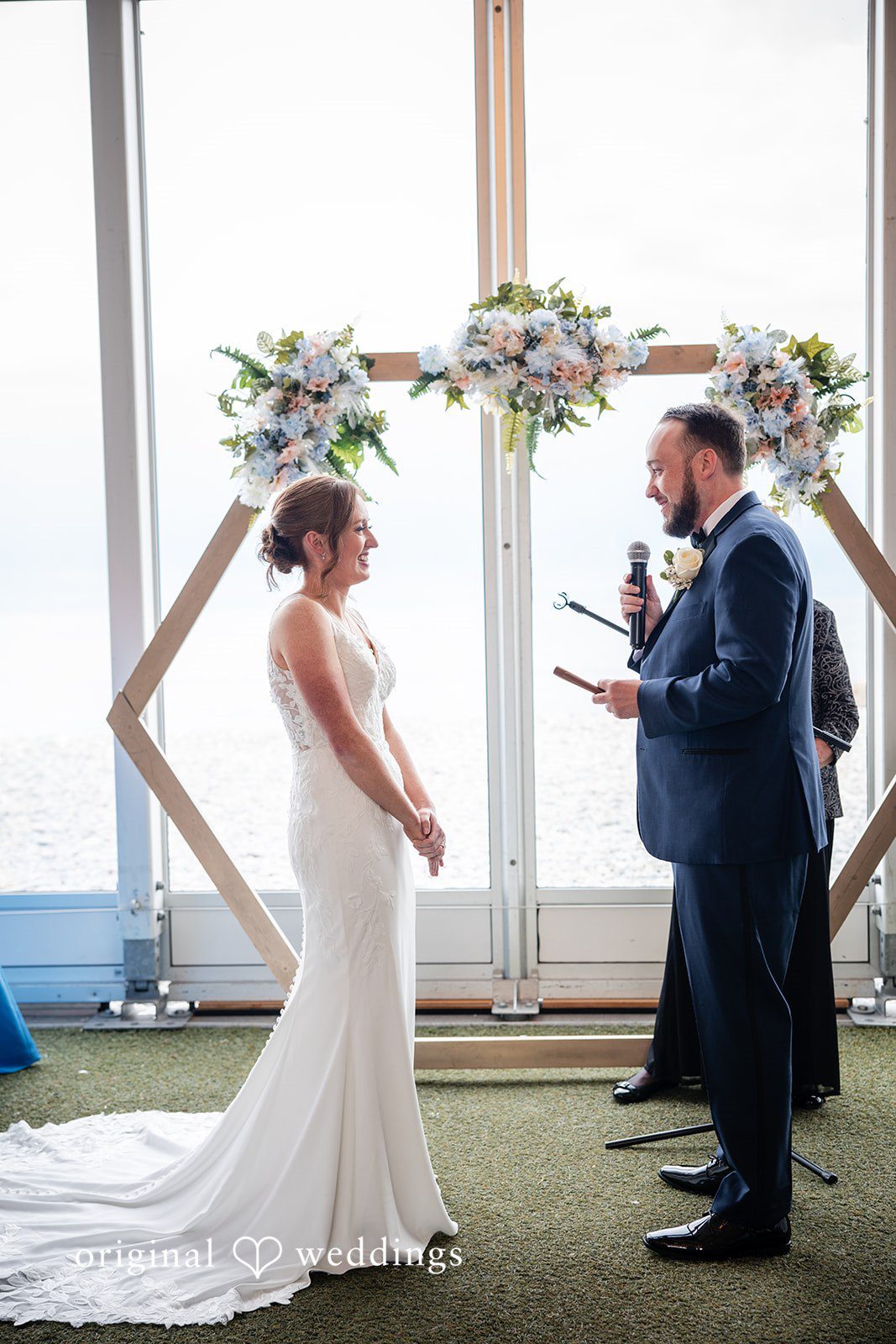Groom reading heartfelt vows to his bride during the wedding ceremony
