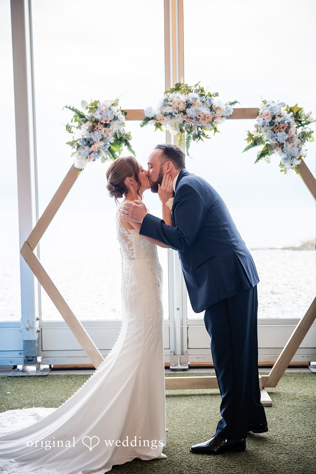 Newlyweds sharing their first kiss after exchanging vows