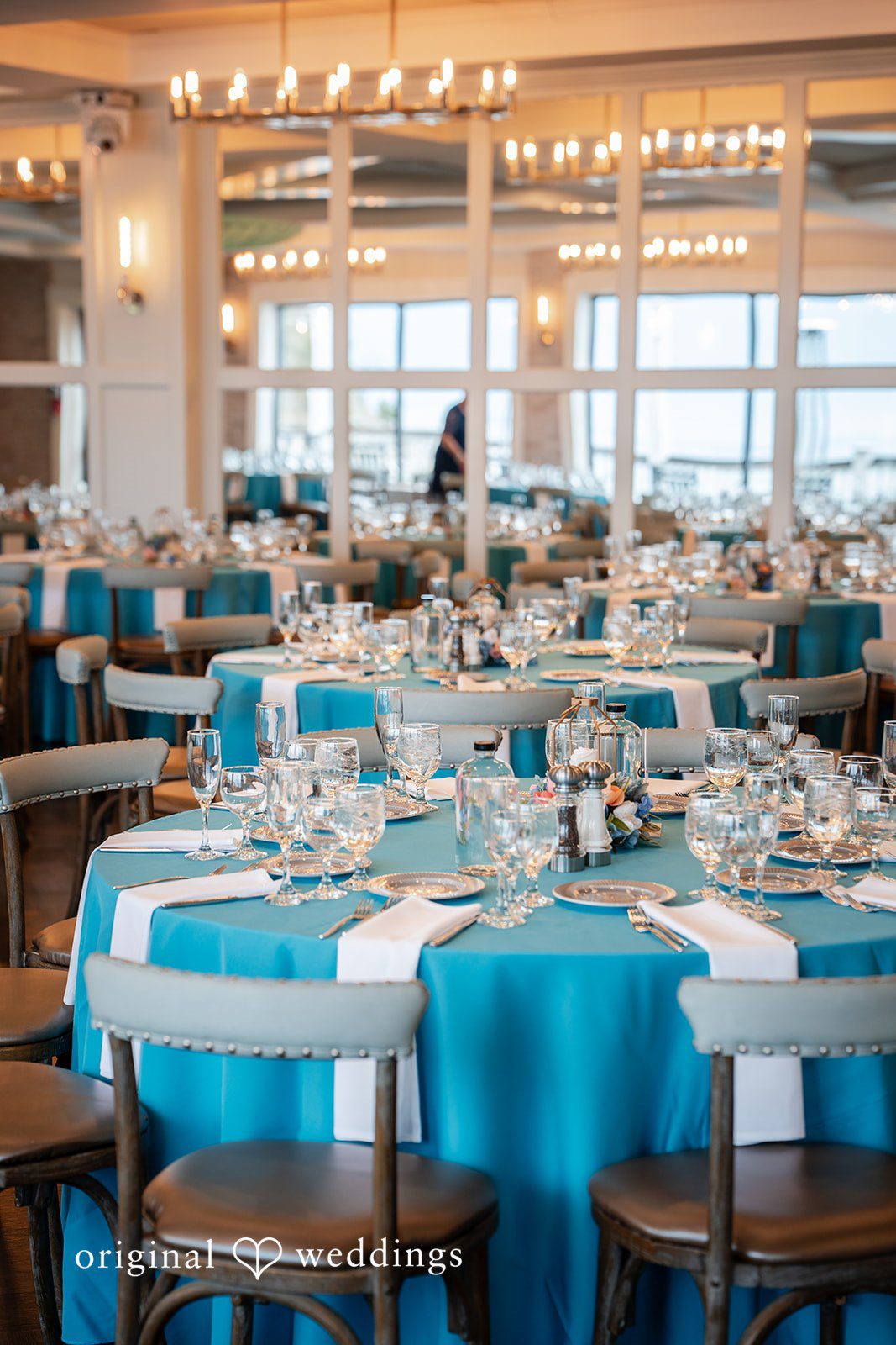Reception tables elegantly arranged for guests at Oceanview of Nahant
