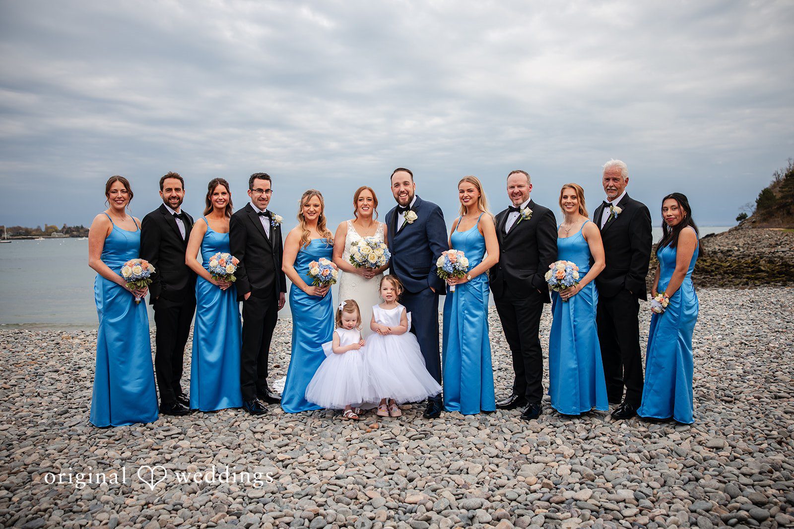 Wedding party portrait with bride, groom, bridesmaids, and groomsmen