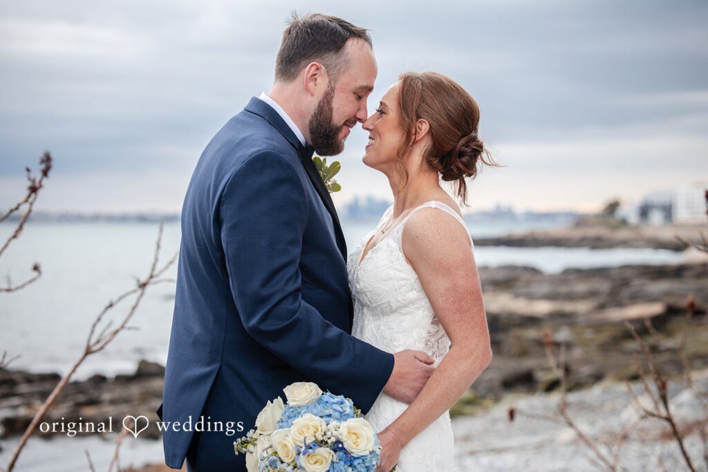 Bride and groom sharing a romantic gaze by the waterfront