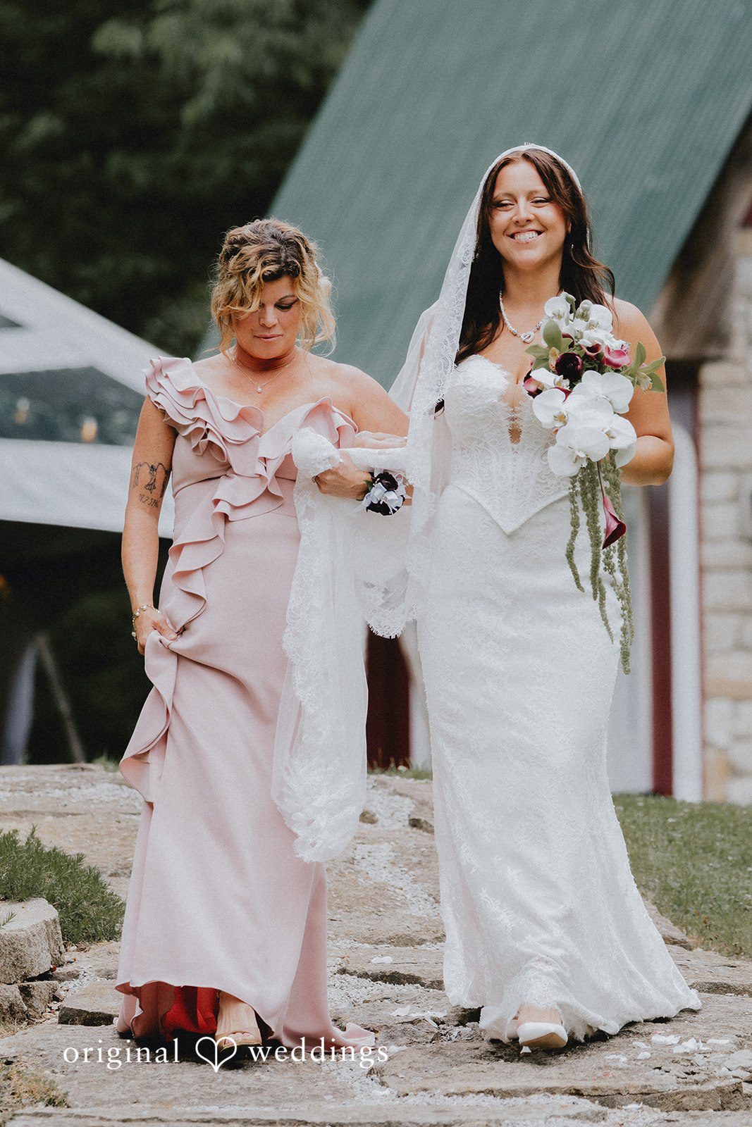 Beautiful bride walking down the aisle with someone