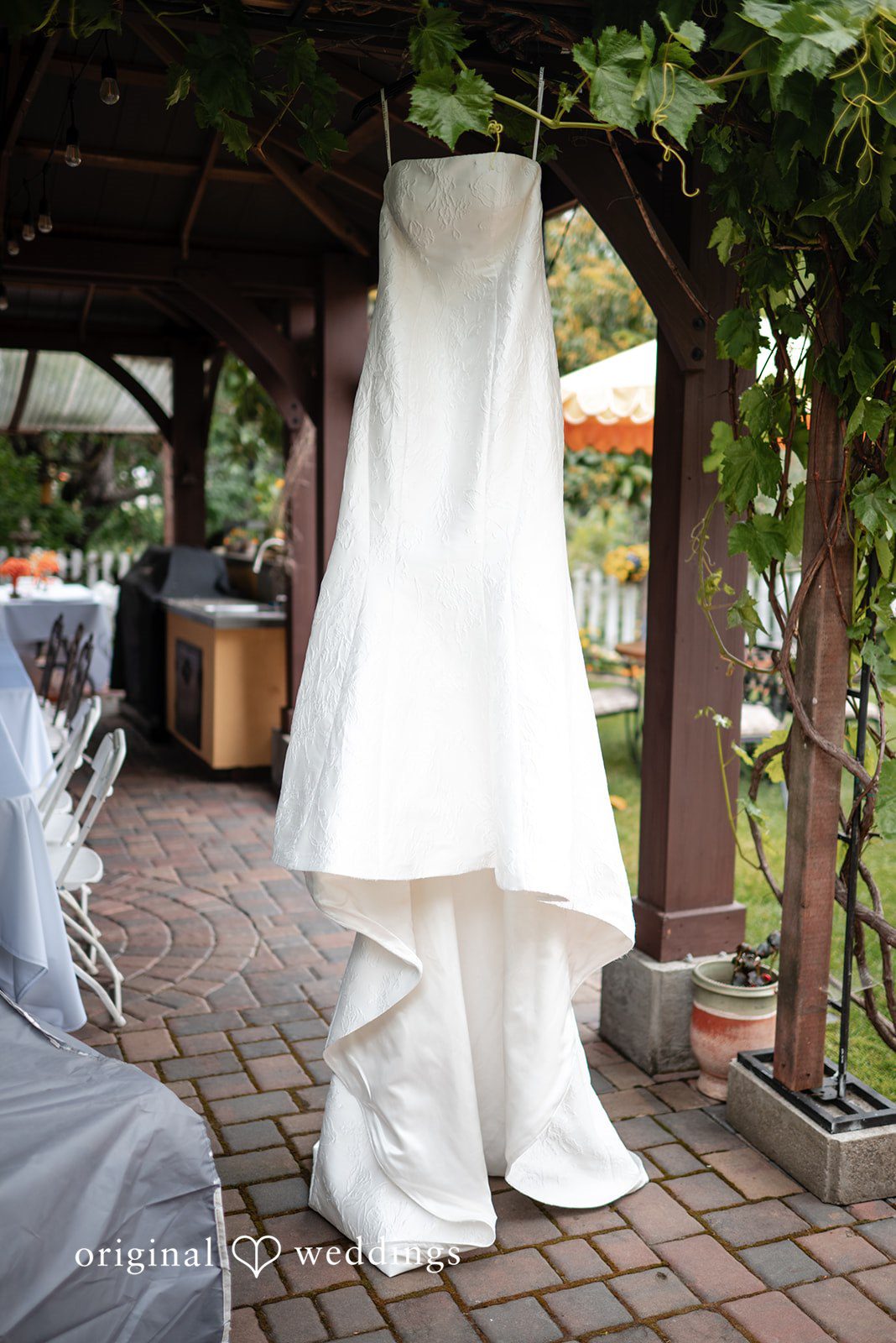 Paulina + Steve Wedding dress hanging before the ceremony begins