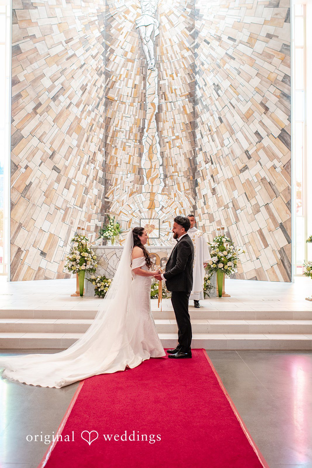 Paulina + Steve Couple sharing their first kiss after the ceremony