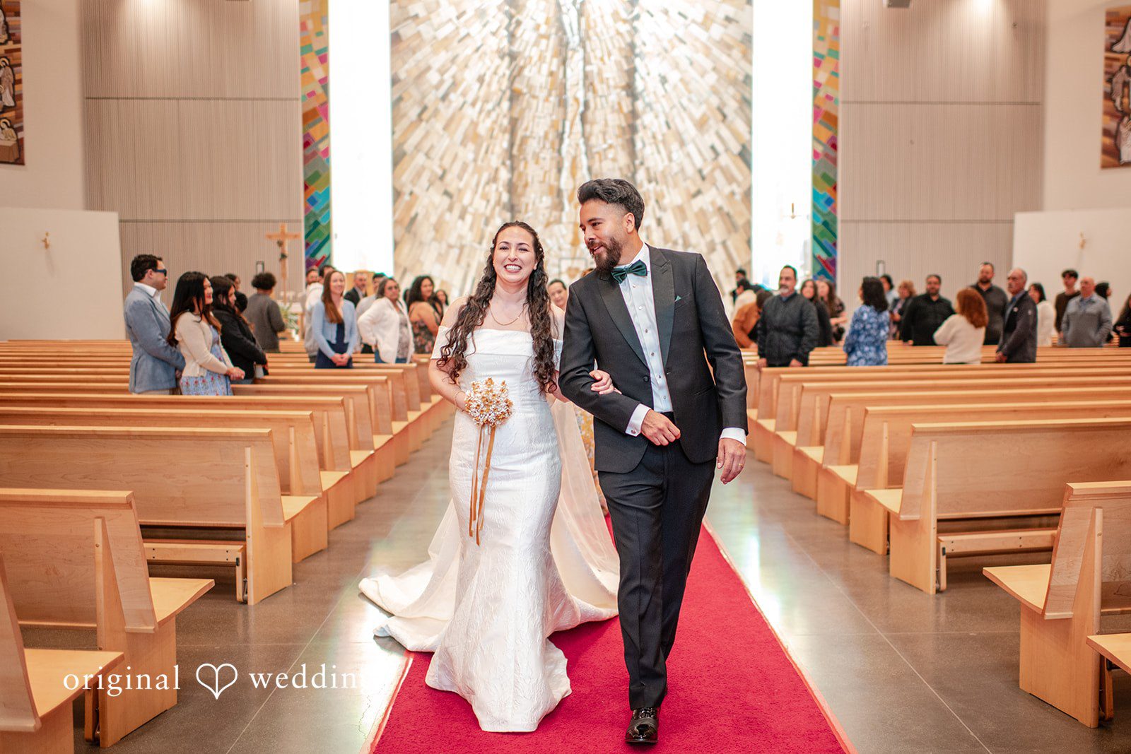 Paulina + Steve Newlyweds walking out of the ceremony smiling together