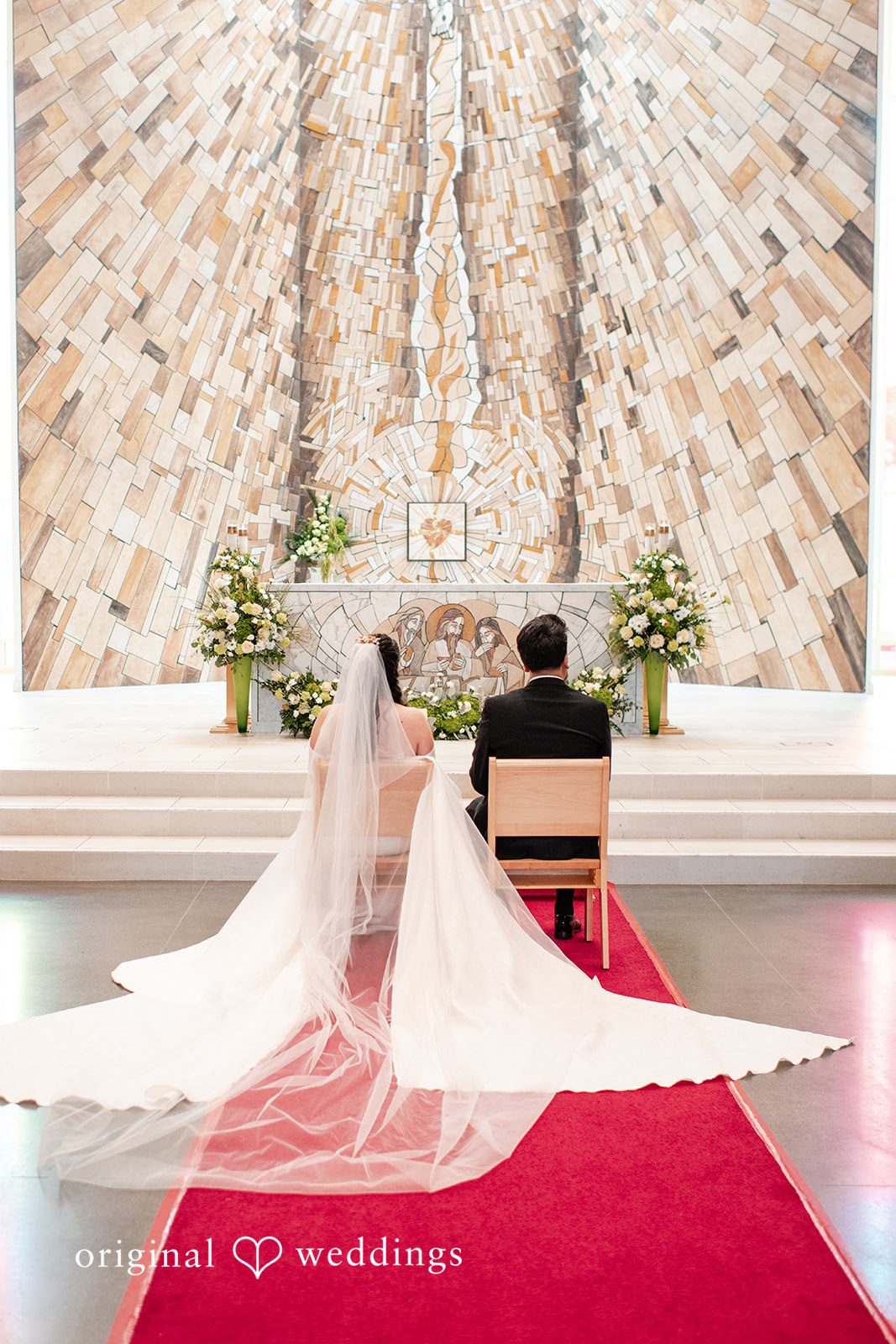 Paulina + Steve Bride and groom listening to vows while seated during the ceremony