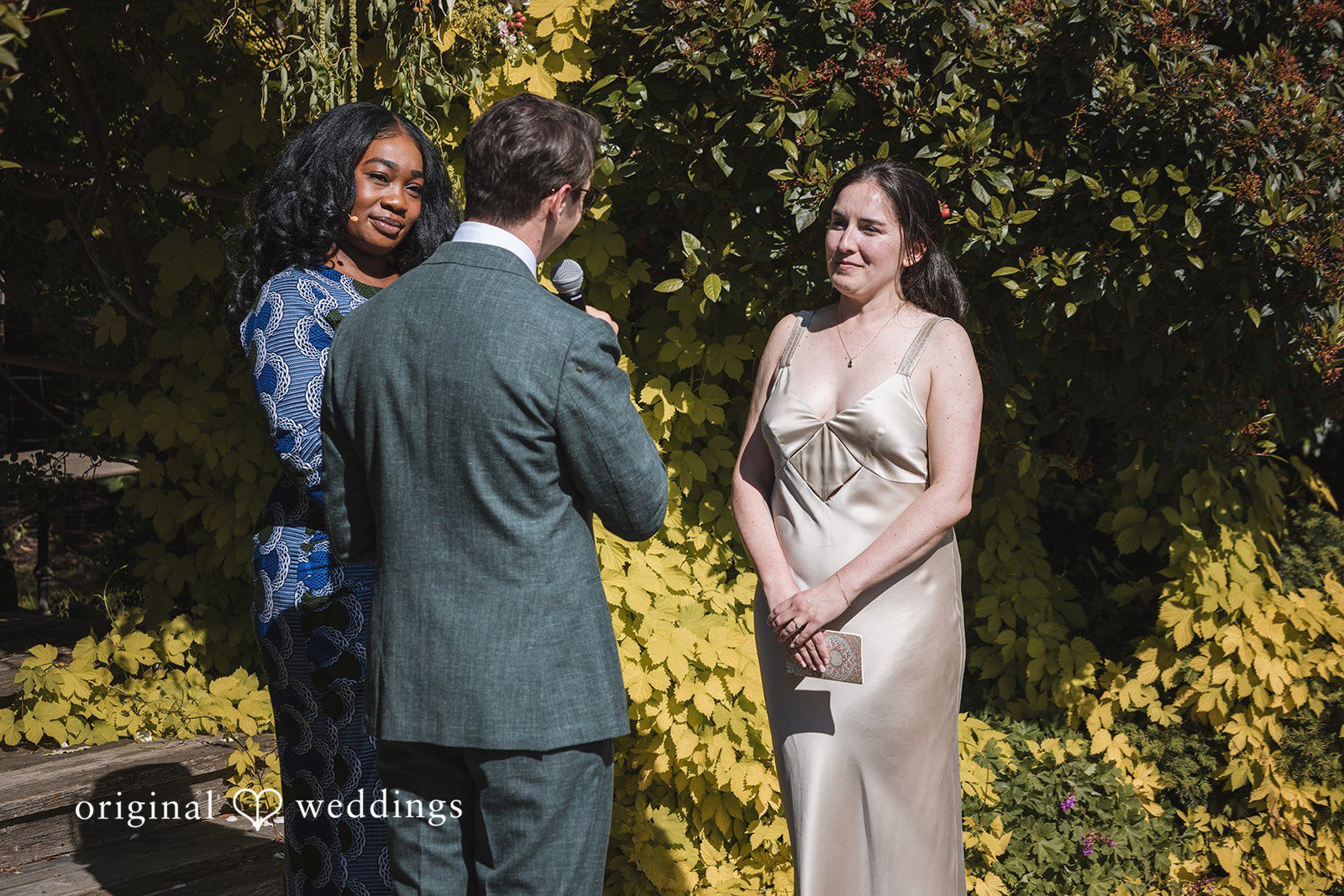 Benjamin + Amber The couple shares heartfelt vows during their intimate garden wedding ceremony